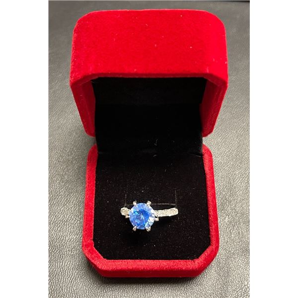 GRA certified blue moissanite weighing 3.00 carat set in sterling silver ring in shank w/8 oval cut