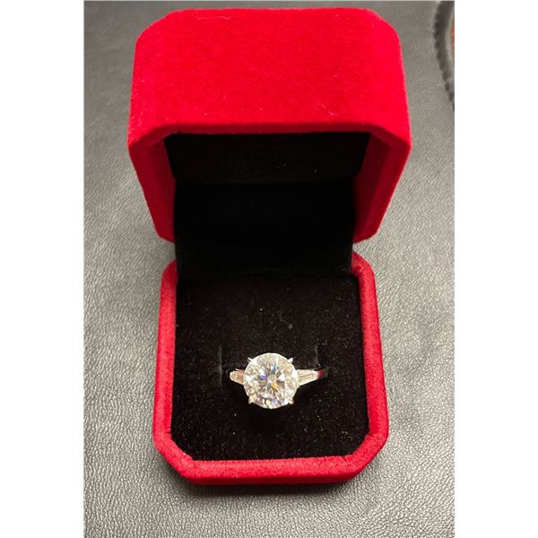 GRA certified 5.00 carat moissanite VVS D colour set in center with a tapered baguette cubic zirconi