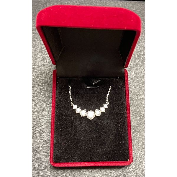 One full cut round brilliant moissanite VVS D in center w/graduating moissanites 3 per slide for a t