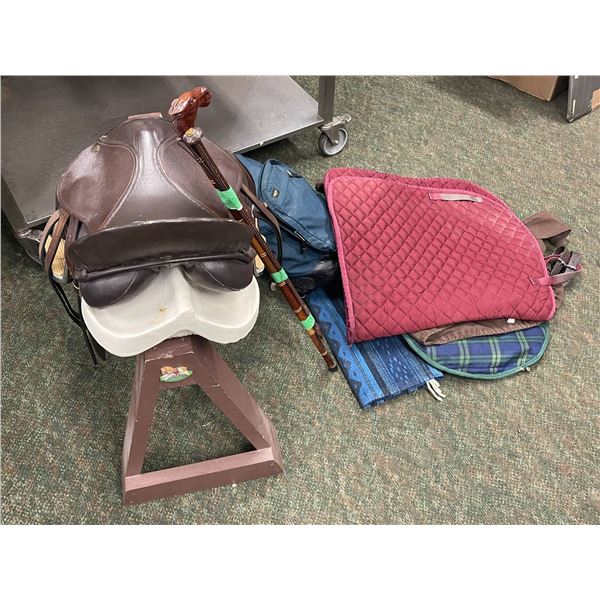 Group of assorted horse riding gear - includes horse saddle w/ stand/ horse whip/ horse wood carved