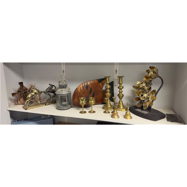 Shelf lot of misc decor items including - goat bookends, candle stick holders, vintage bells, wooden