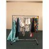 Image 1 : Rack full of misc. set dec clothes - included Christmas sweaters/t-shirts/jeans/dresses (approx. 40