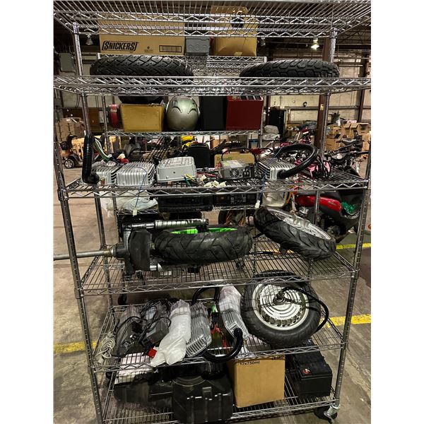 5 shelf lot of misc items including - shelf, tires, MW 3 stage switching mode battery chargers, e-sc