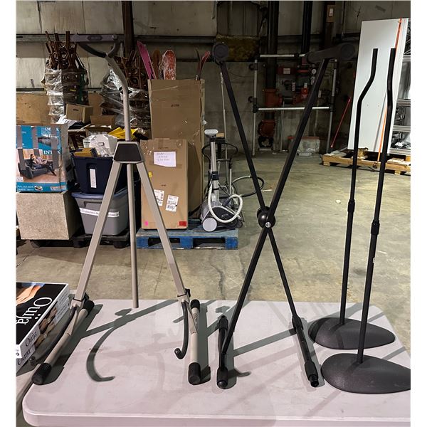 Table of misc items including - cello & bass stand, keyboard stand & speaker stands