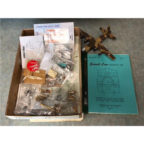 Box of misc toy train parts