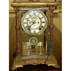 American Ansoina Ornate Brass Case with Beveled Class, Open Movement Escapement, and has Rhinestones