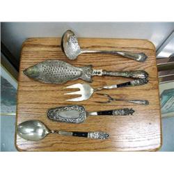Very ornate fish serving spoon; old Rogers ladle; silver h'oerdorve fork; 3-piece fork, spoon and pi