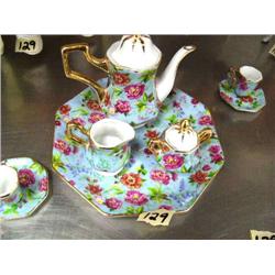 Collection of 3 Shirley Temple dolls; 3 chairs; children's tea set; miniature Coca-Cola glass (16)