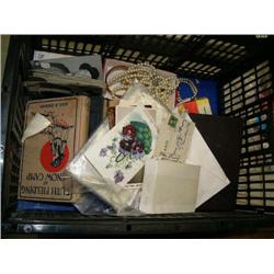 Box of: books; costume jewelry; old movie star postcards and stamps; old radio; set of wood checkers