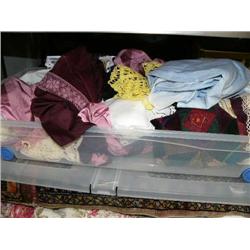 Plastic bin full of lace, linen, and fancy cloth (16)