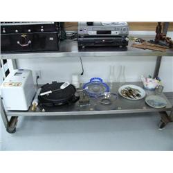 Lot of entire bottom shelf: oak plant stand; bread maker; marble rolling pin; frying pan; 3 pieces o