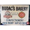 Image 1 : Single Side Hardboard Sign "BUDAC'S BAKERY" (Logos for CALGARY & ROYAL CROWN COLA) (34"H x 46-3/4"W 