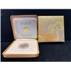 Image 1 : 2004 $150 YEAR OF THE MONKEY 18-KARAT HOLOGRAM COIN