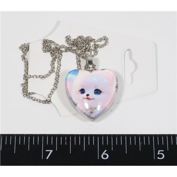 NEW HEART SHAPED PENDANT. 1 SIDE HAS A PUPPY