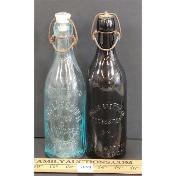 LOT OF 2 - EMBOSSED BREWERY BOTTLES - INCL MILLER & LOESCHER