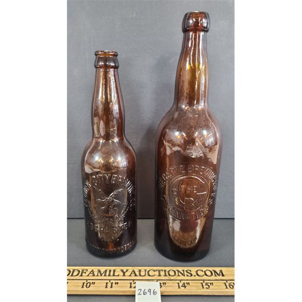 LOT OF 2 - EMBOSSED BREWERY BOTTLES - INCL THE CERKE & FLOWER CITY