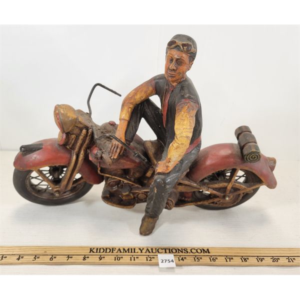 CARVED MAN ON MOTORCYCLE