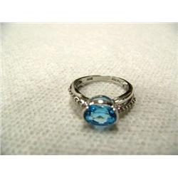 Blue Topaz (approx. 1.75 carats) and Diamond (approx. 0.13 carats) Lady's Ring 14 K white gold, repl