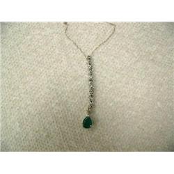 Emerald (approx. 0.60 carats) and Diamond (approx. 0.13 carats) Pendant and Chain 14 K yellow gold, 