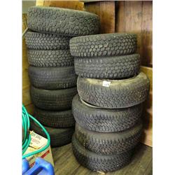 Lot of: 13 tires- 5 studded, some on rims (16)