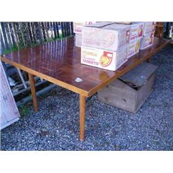 Large wooden dining room table with inlaid checker board pattern (36)