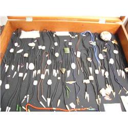 Lot of: 33 scrimshawed bolo ties; ivory beads; trade tokens from Ketchikan; 1 old Navajo style pot (