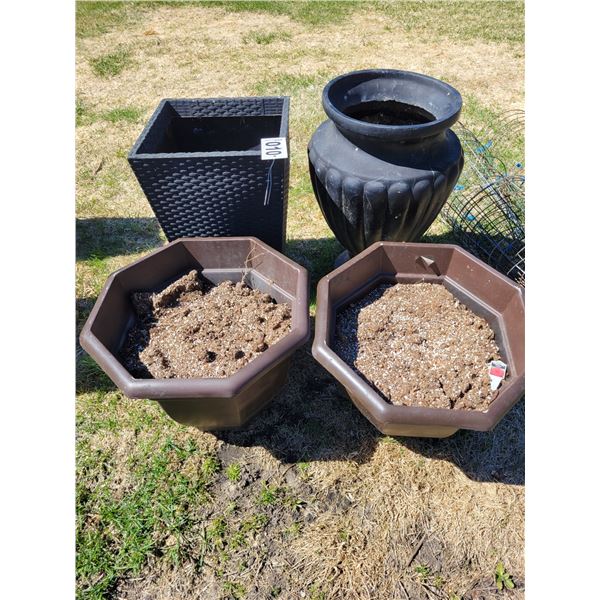 4- huge planters, solid plastic, 2- 16" octagon planters 14" high, 2- 2' planters,1 round, 1 square