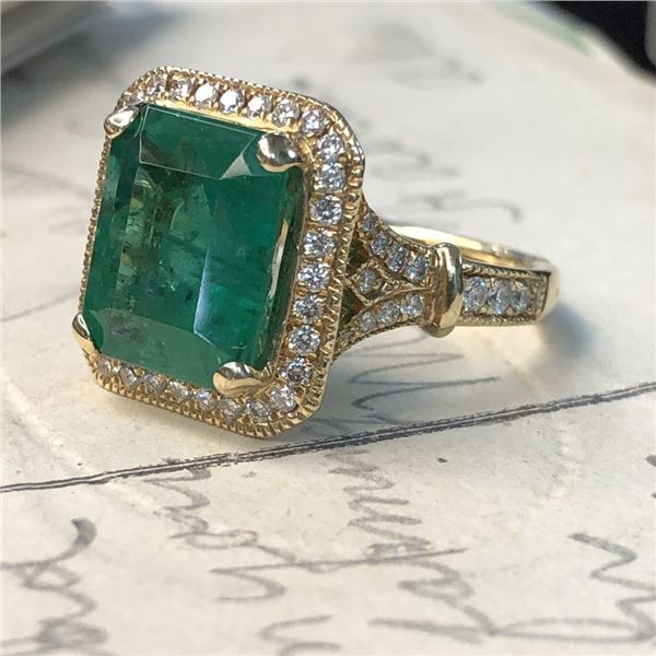 Enchanting Emerald Ring with Peek-a-boo Diamonds