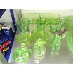 Fabulous lot of green depression glass: 2 refrigerator dishes; 3 measuring cups 1 is chipped; 3 lemo