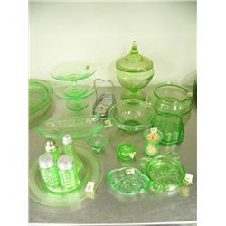 18 pieces of green depression glass: covered candy dish; salt and pepper shakers; salt dips; toothpi