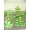 Image 1 : 18 pieces of green depression glass: covered candy dish; salt and pepper shakers; salt dips; toothpi