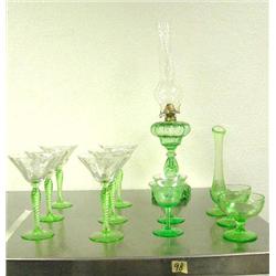 Lot of 12 green depression glass items: 10 stems some are chipped; vase; kerosine lamp (39)