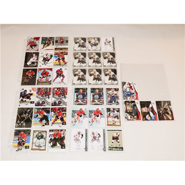 BUNDLE OF HOCKEY CARDS IN PROTECTIVE SLEEVES