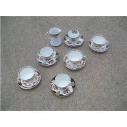 Cups, saucers, creamer.