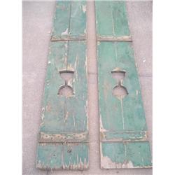 Old pair of green wood shutters