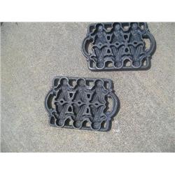 Two cast iron gingerbread molds