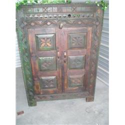 Carved wood cabinet