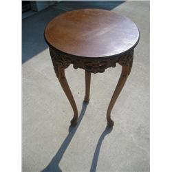Round carved wood table
