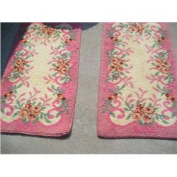 Two matching pink and white rugs