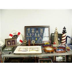1 shelf of nautical items: framed knots, life ring, lighthouses, ships in a bottle (8888)