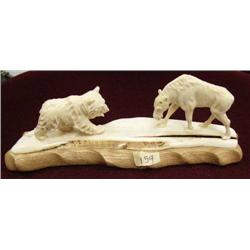 Ivory carving of bear and moose on wood base- moose is missing antlers (100)