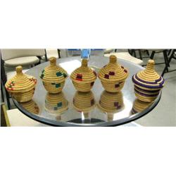 Lot of 5 African handmade grassbaskets with designs: three are 4" tall and two are 3-1/2" tall (2)