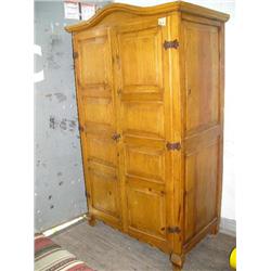 2-door arch top pine robe cabinet set up to be used as TV cabinet, Indian style rug- wardrobe sectio
