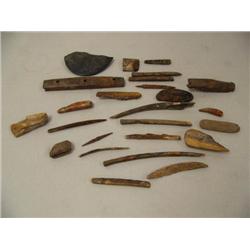 Lot of 24 ivory artifacts and 1 slate ulu (2)