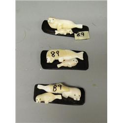 Group of 3 ivory seals mother and child mounted on baleen by Robert Apatiki (2)