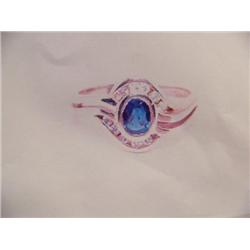 Sapphire and Diamond Lady's Ring 14 K yellow gold- sapphire is oval, faceted approx. 0.33 carats tra