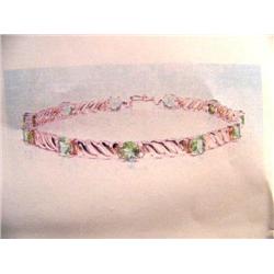 Peridot Bracelet 14 K yellow gold- peridot are oval faceted approx. 3.33 carats transparent and ligh