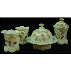 FOUR PIECE SET OF CUSTARD GLASS