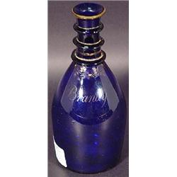 A COBALT BLUE BLOWN GLASS THREE RING BRANDY DECANTER