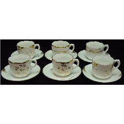 SIX MATCHED GERMAN PORCELAIN TEA CUPS AND SAUCERS